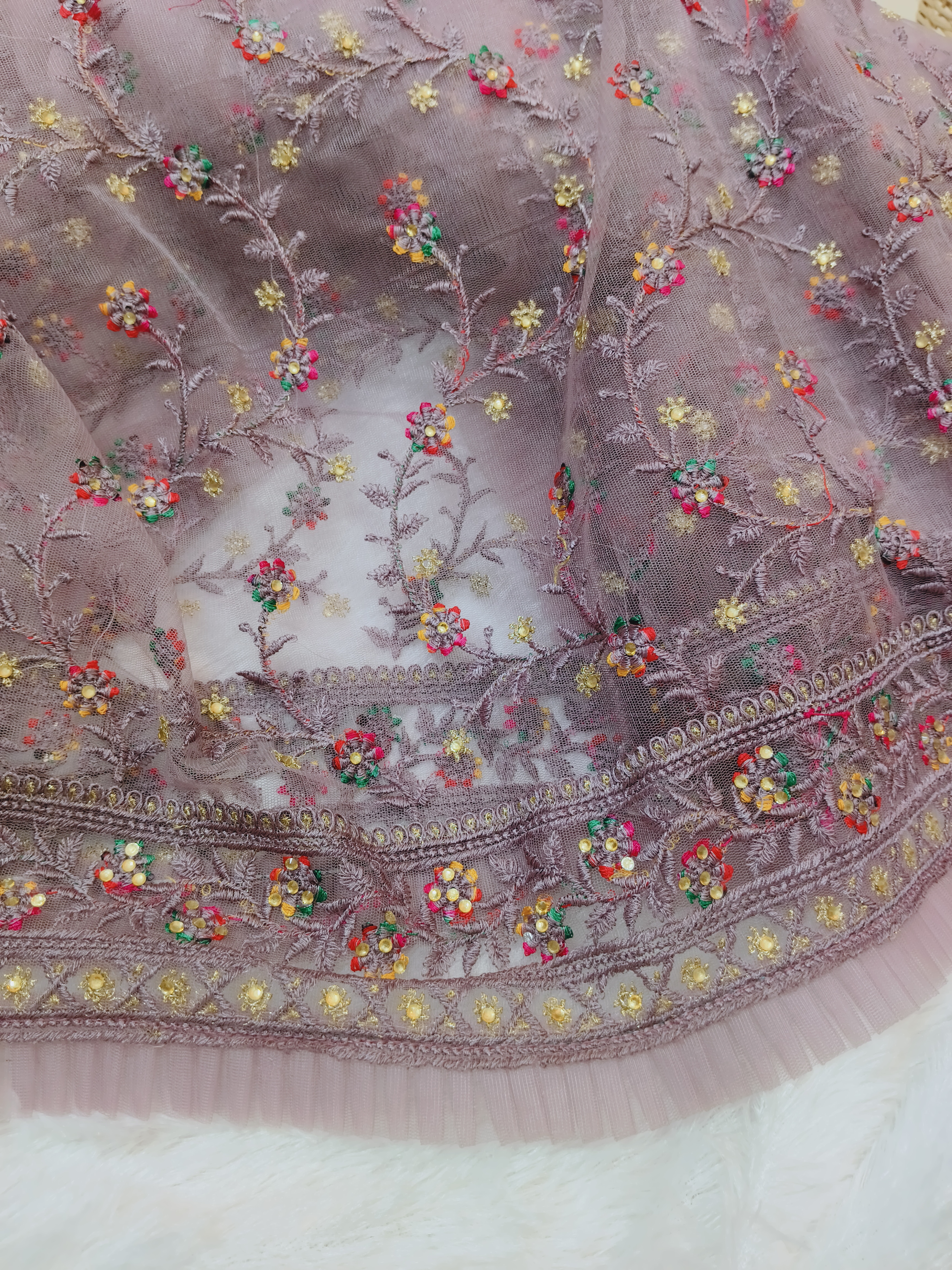 Dusty Mauve Netted frill Saree with Multicolor Floral Embroidery