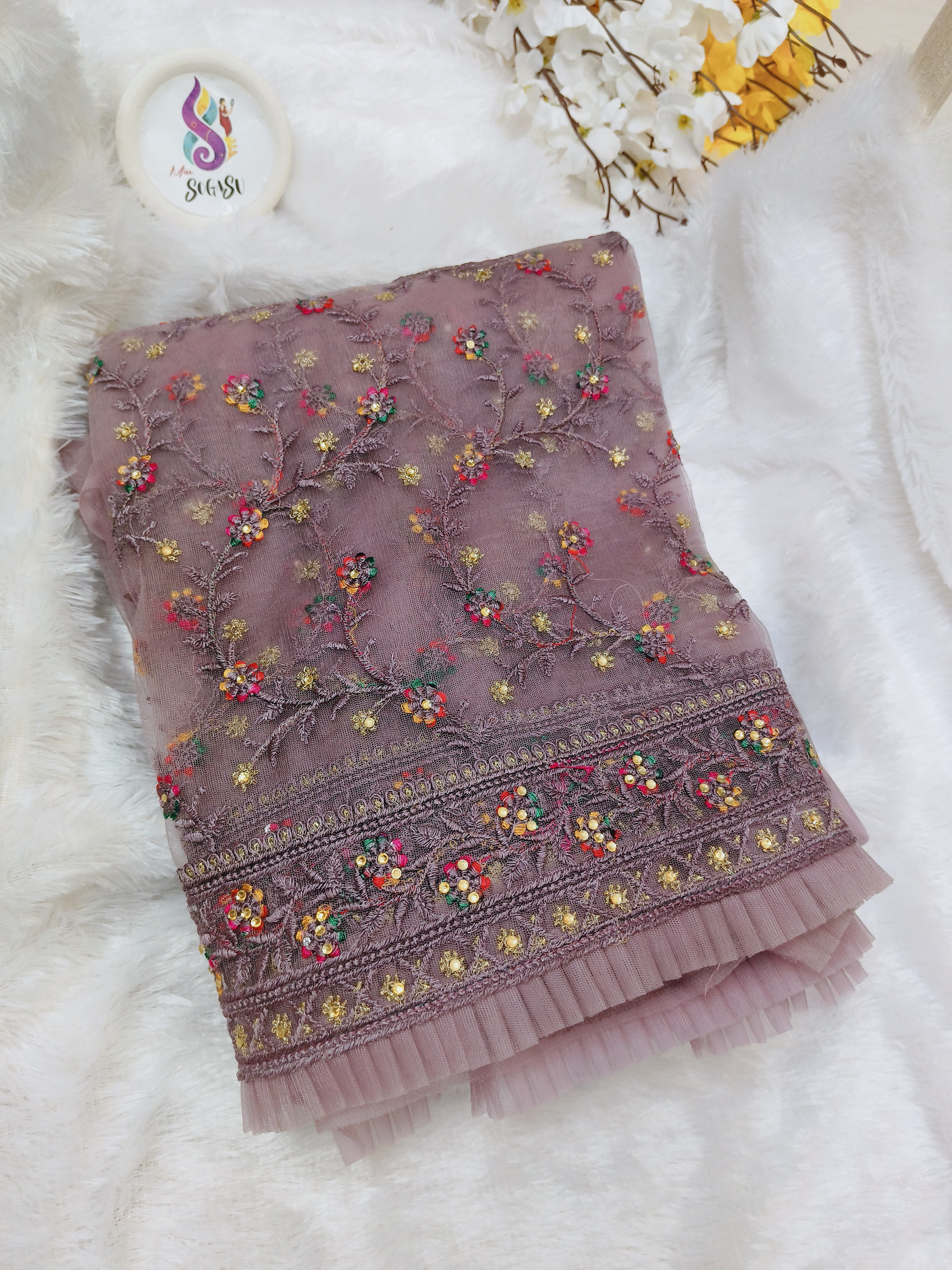 Dusty Mauve Netted frill Saree with Multicolor Floral Embroidery