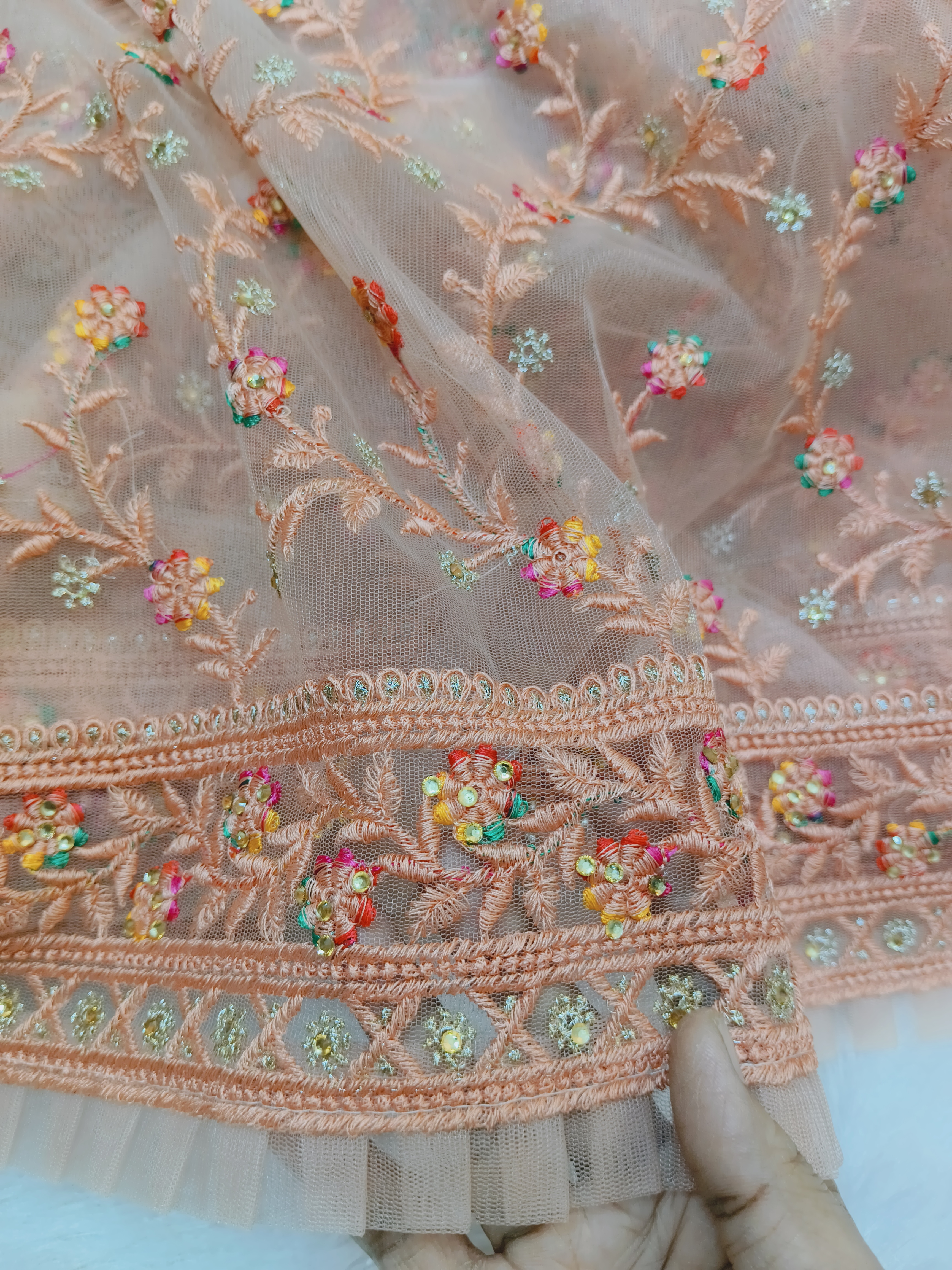 Peach Netted Frill Saree with Multicolor Floral Embroidery