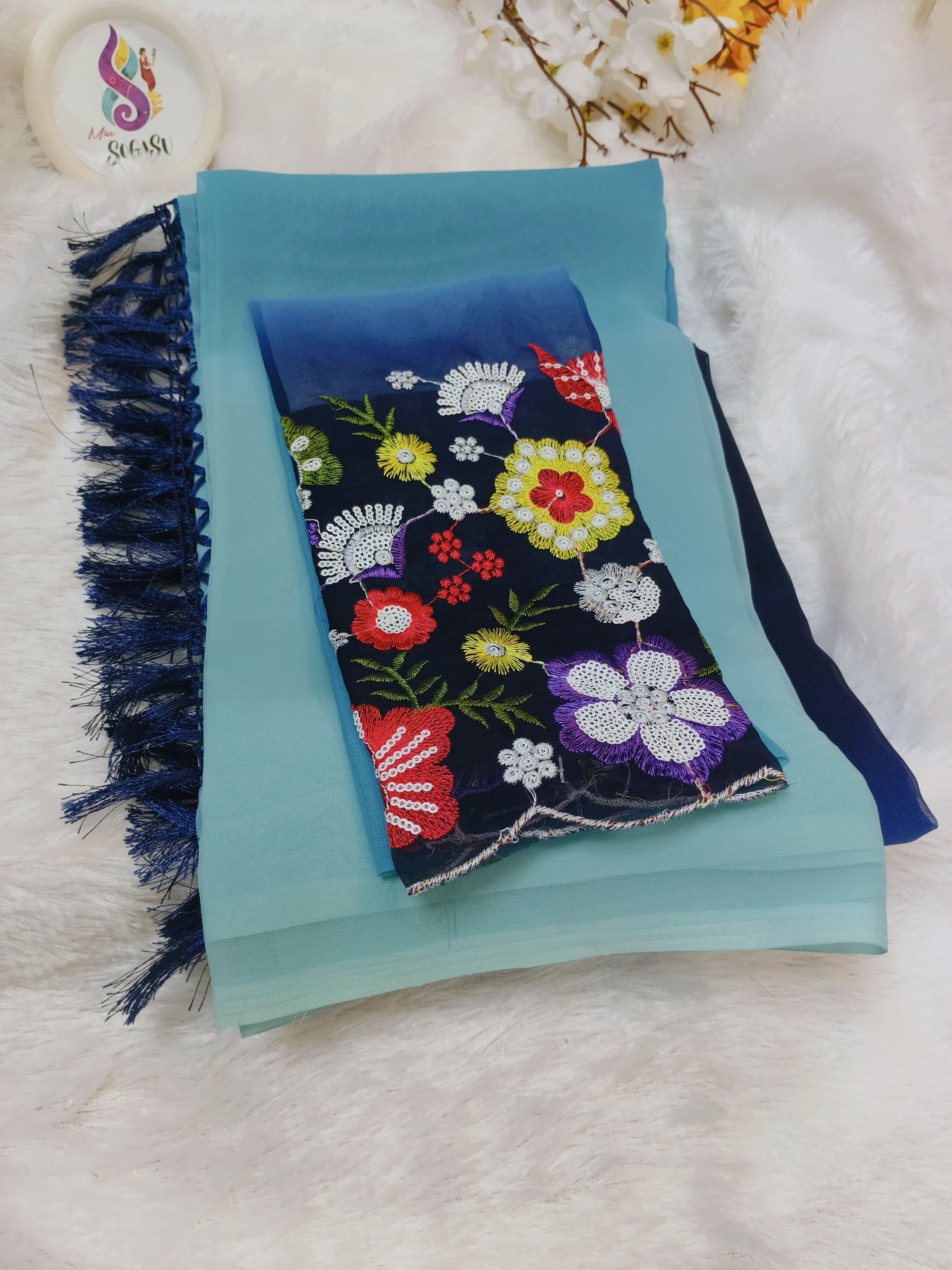 Teal Blue Georgette Saree with Floral Embroidered Blouse